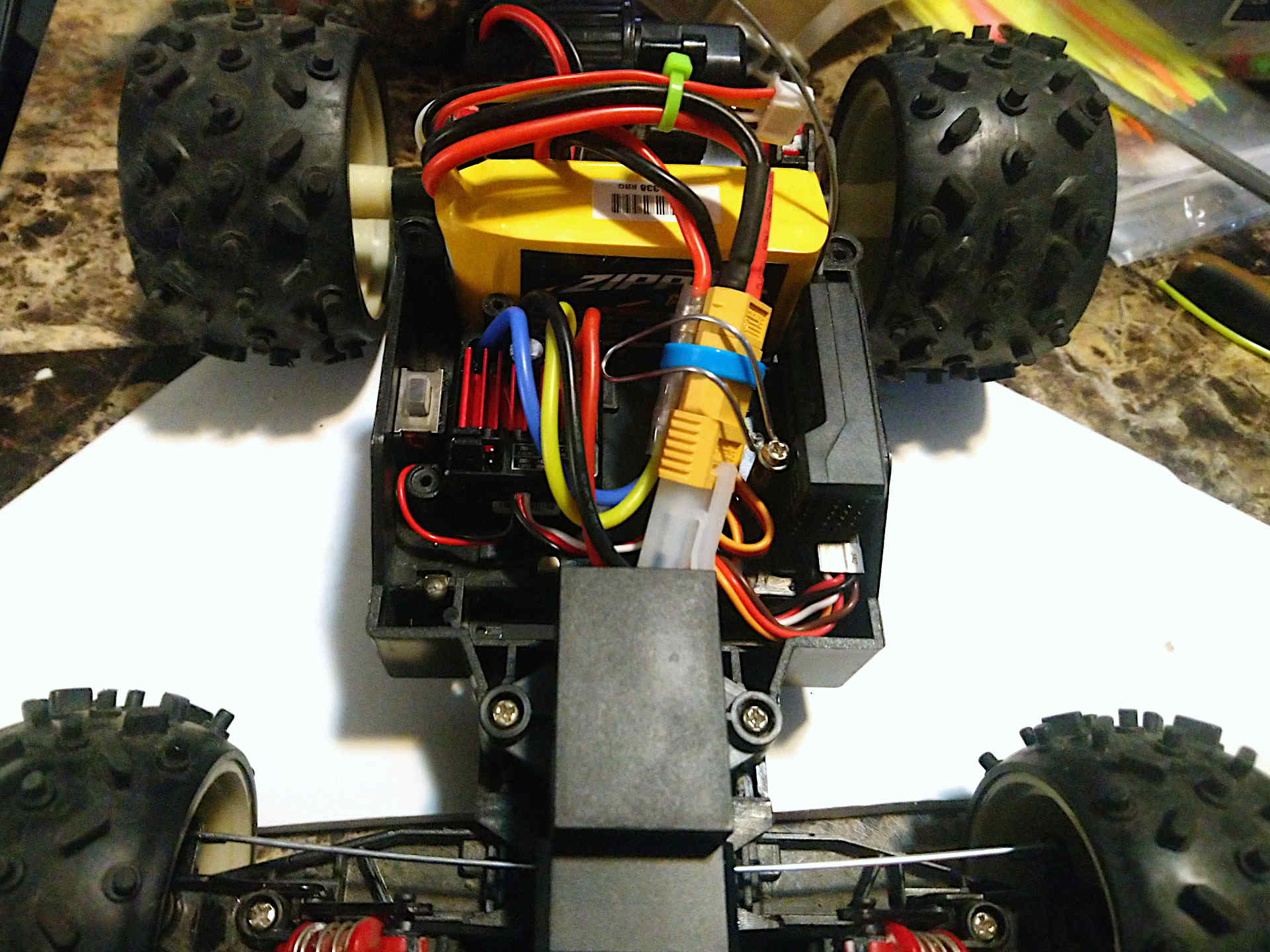 Hardware inside the car chassis with a retaining wire installed