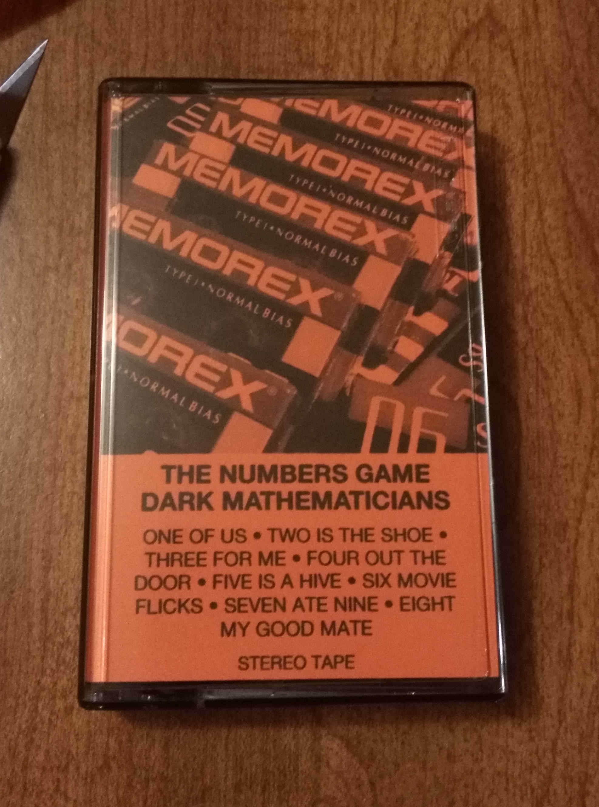 J-card inside a cassette tape case