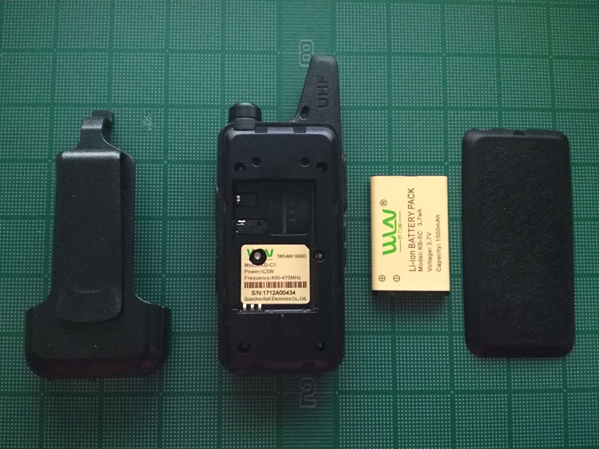Radio with belt clip and battery removed